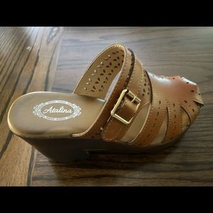 Gently worn with platform clogs. Only worn one time for about 3 hours!